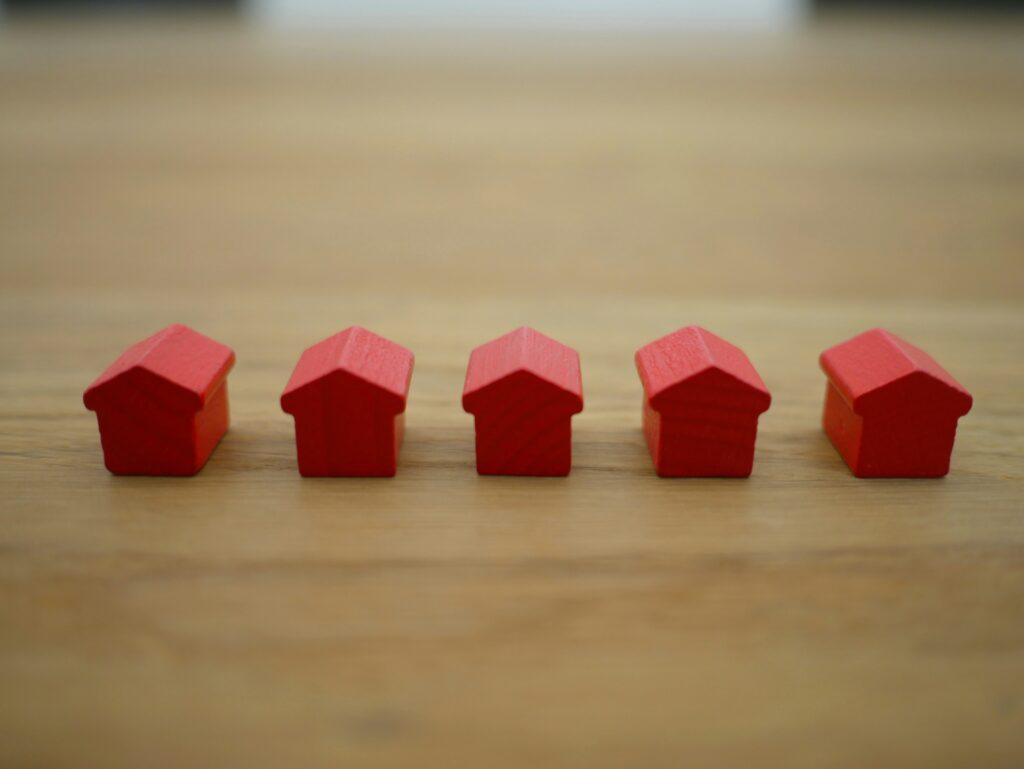 Row of small red wooden houses on tabletop